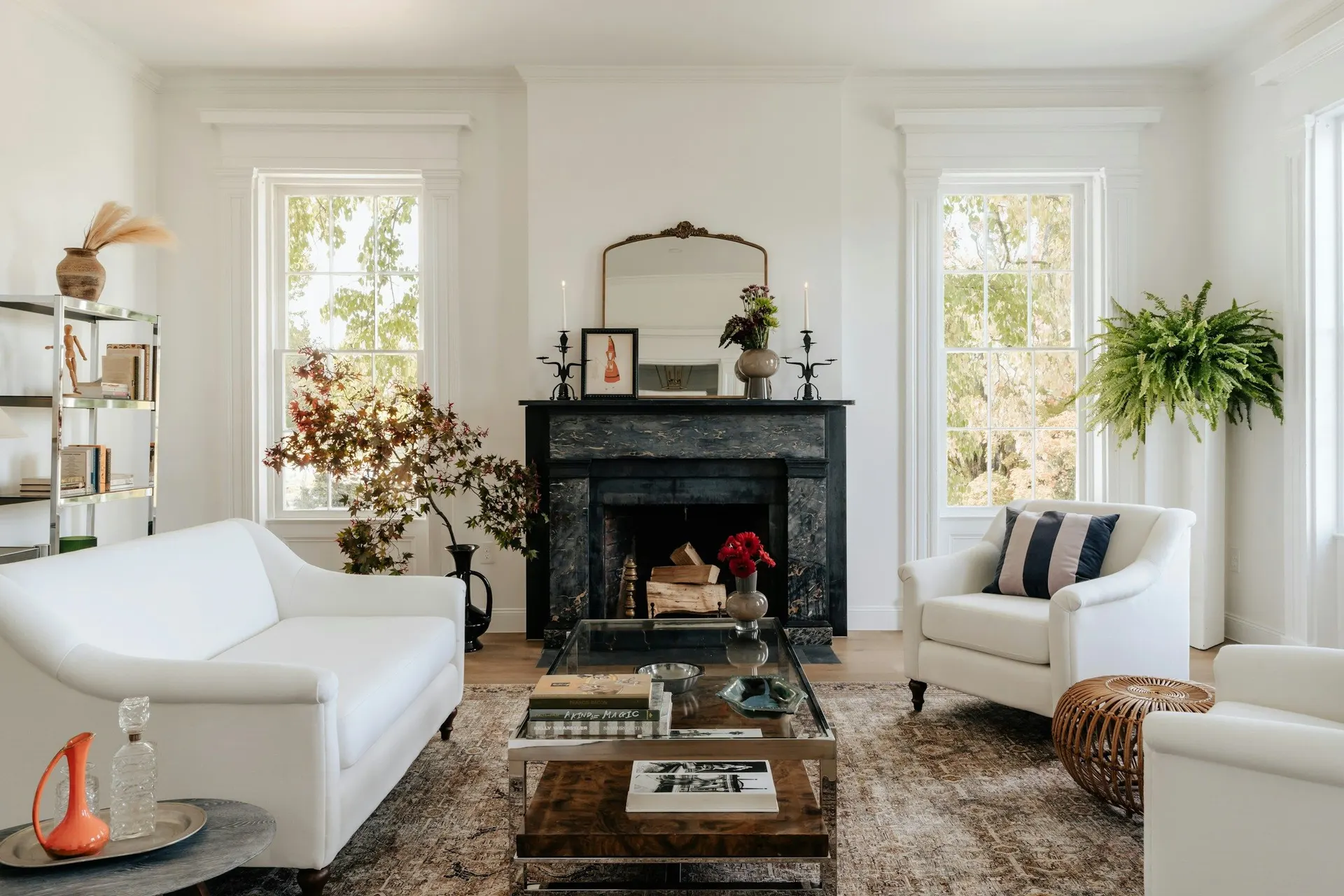 A living room filled with furniture and a fire place