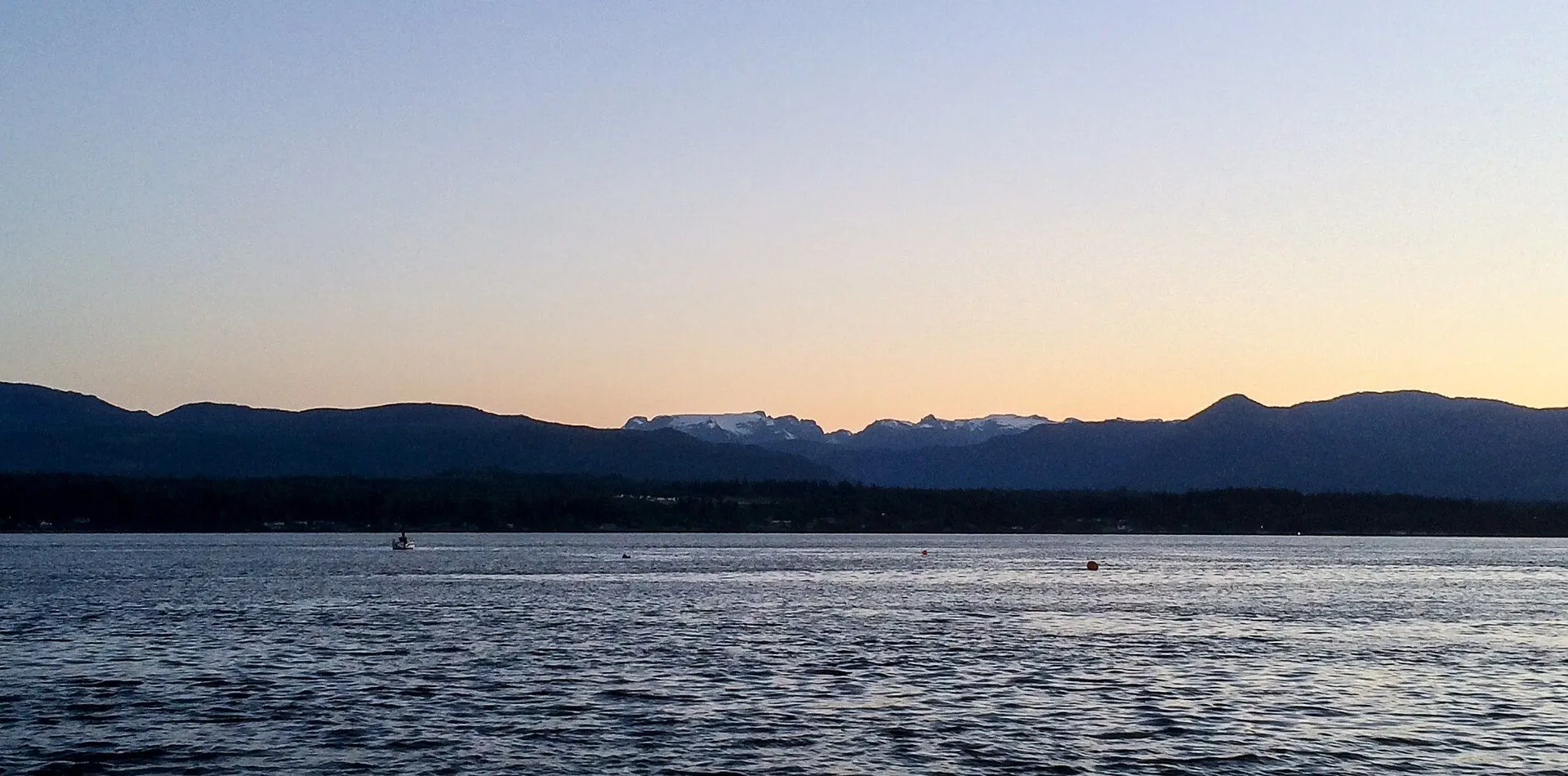 The Comox Glacier over Comox Harbour in the evening
