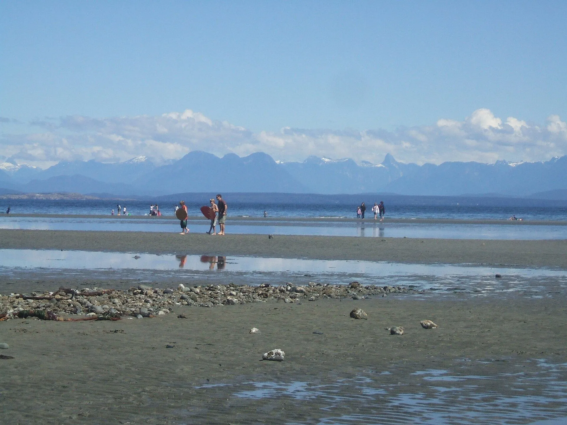 Low tide at Miracle Beach with the Coast Mountains across the Strait