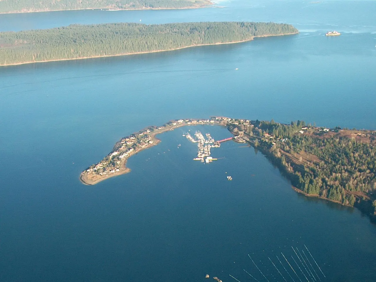 Deep Bay harbour and spit from the air, with Baynes Sound beyond